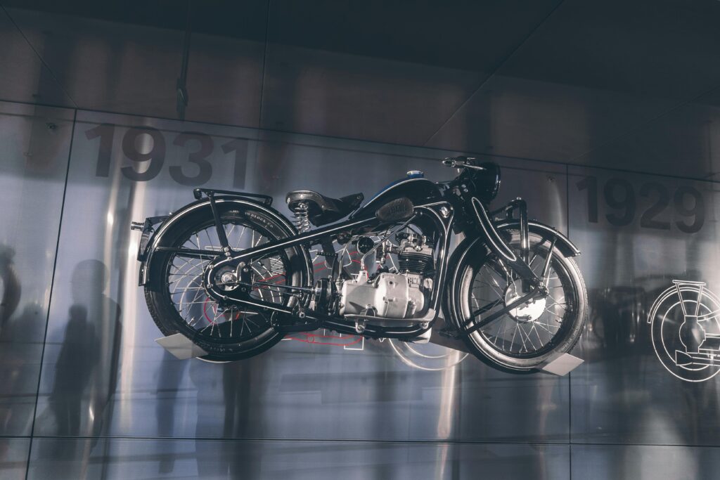 Classic BMW motorcycle showcased in Munich museum, highlighting vintage design and engineering.